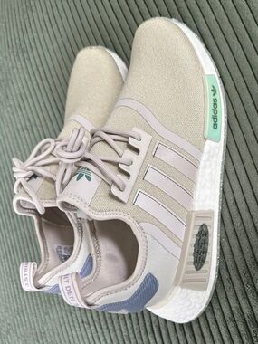 Adidas NMD R1 running shoe in “bliss” (iridescent accents)